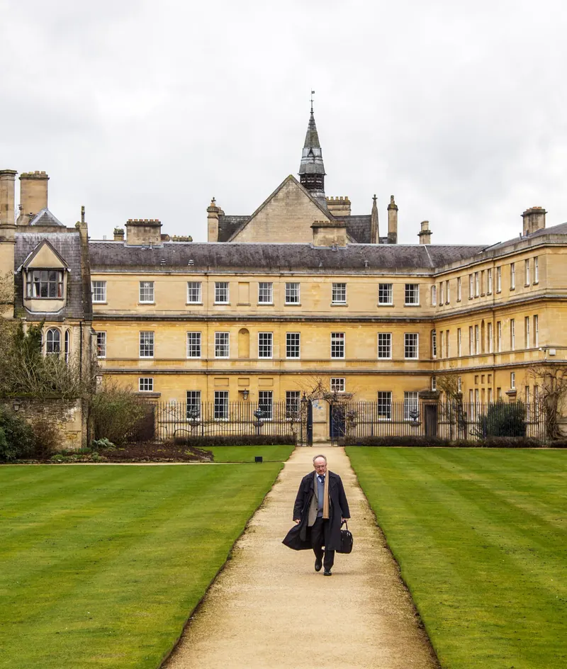 A garden path leading to a historic Oxford college building